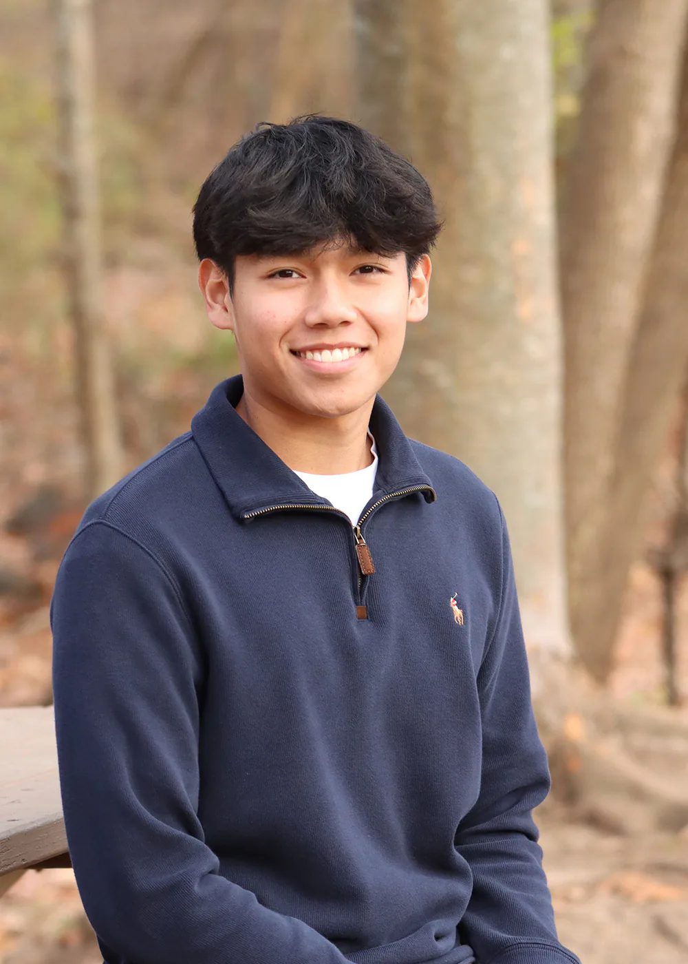 Arvino Mahadi outdoors in a navy pullover.