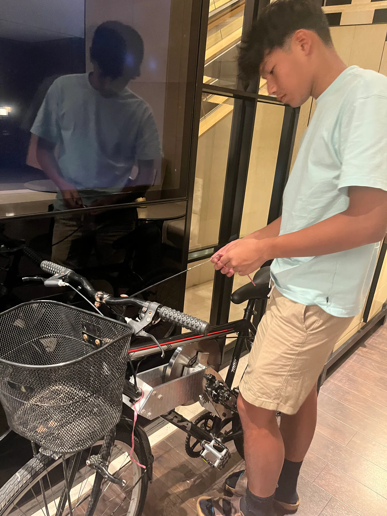 Arvino assembling the flywheel-bike prototype.