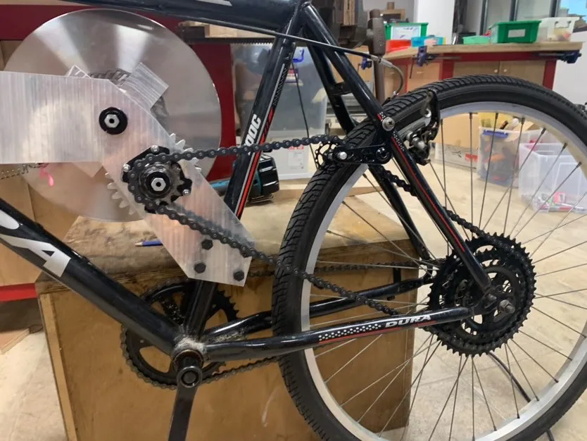 Close view of the mounted flywheel and chain drive.