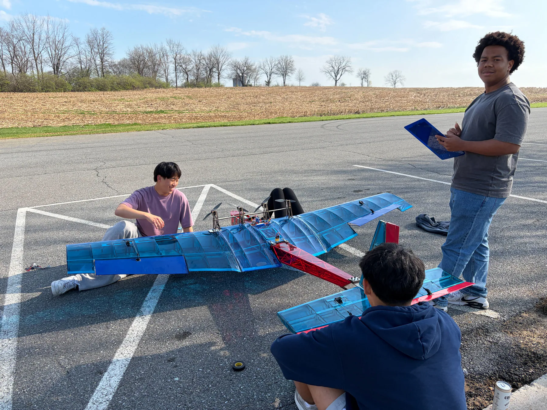 Penn Aerial Robotics team preparing the assembled Leviathan aircraft outdoors.