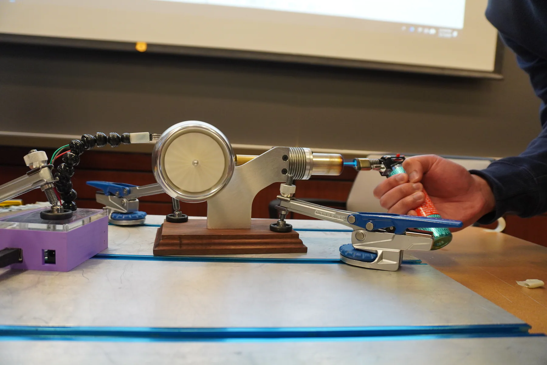 Completed Stirling engine with a turbine-inspired flywheel.